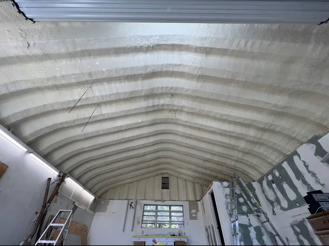 Spray polyurethane foam applied to the underside of a metal roof deck in Newberry